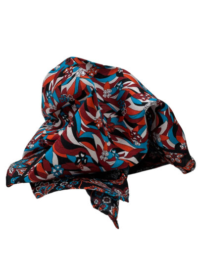 Pochette multicolor con estampado floral y negros naranjas y turquesas